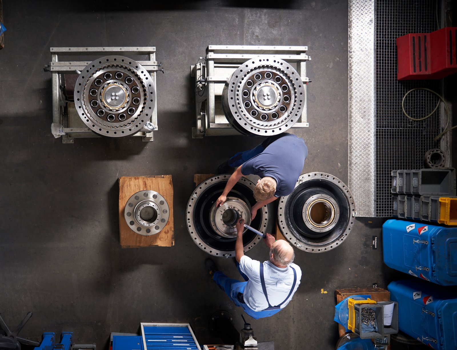 Bird's eye view of technicians and gearboxes