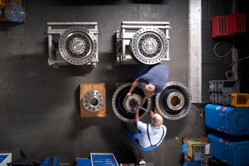 Bird's eye view of technicians and gearboxes